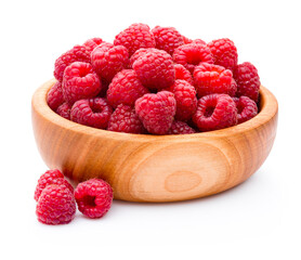 Ripe raspberries in wooden bowl isolated on white background
