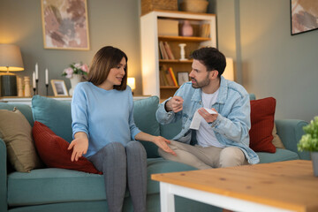 Obraz premium Stressed emotional young family couple arguing, blaming each other of overspending money, having financial problems