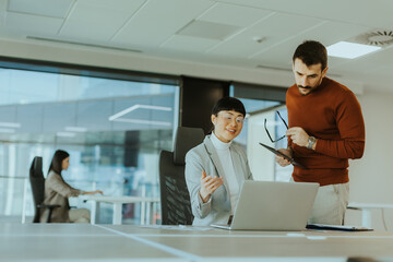 Engaging conversation between colleagues in a modern office during a productive workday