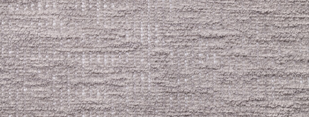 Light gray fluffy background of soft, fleecy fabric cloth. Texture of beige textile backdrop with pattern