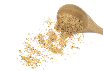 Walnut chopped, grated pile in wooden spoon isolated on white, top view