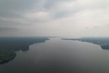 Scenic view of a river winding through lush green forests in Amazon