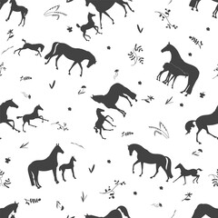 Seamless pattern with horse silhouettes and floral elements on a white background