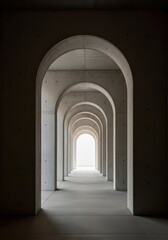 Series of concrete arches leading to a bright light at the end