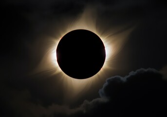 Obraz premium Stunning solar eclipse with a halo effect surrounding the moon