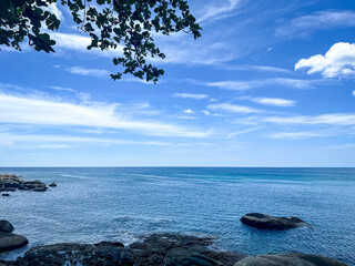 Tropical Beach Paradise with Crystal Clear Water and Rocky Shoreline in Phuket, Thailand