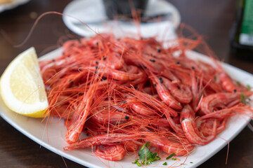 Boiled camarones little red shrimps on plate in restaurant La Palma Canary islands Spain