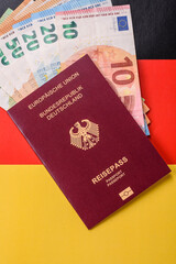 German citizen passport against the background of the German national flag