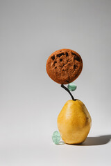 Still life with pear and oatmeal cookies