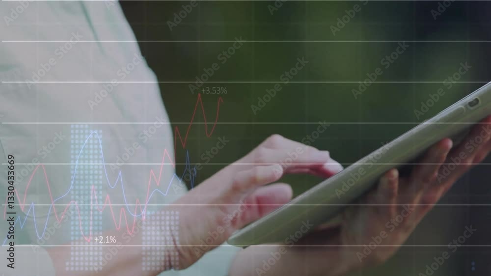 Poster Using tablet with financial graphs and data overlay, hands doing analysis
