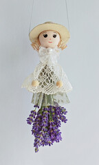 Handmade doll with dried blooms captures cozy flair, lavender skirt highlighting delicate style,...