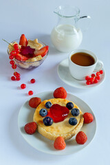 Delicious Breakfast with Cheesecake and Fresh Berries on a Light Background