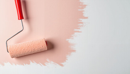 Paint roller applying soft peach color on white wall, home improvement
