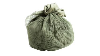 Decorative green mesh bag filled with assorted organic materials displayed against a plain background