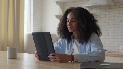 Smiling Woman Waves Goodbye While Ending Video Call With Friend On Tablet