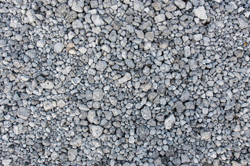 Texture of scattered gray gravel, ideal for construction, outdoor decor, and nature photography. Great for adding rugged charm to creative and design projects.