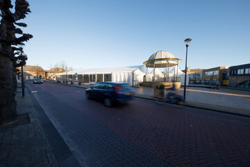 Outdoor event space prepared for function in a city street during early evening hours