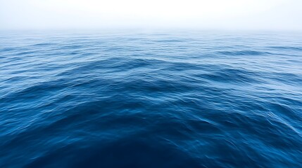 Fototapeta premium Deep Blue Ocean Waves Under a Misty Sky