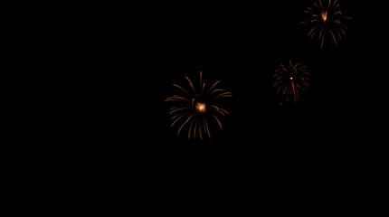 Festive Night Sky Fireworks Display - Vibrant Orange Bursts Against Dark Background