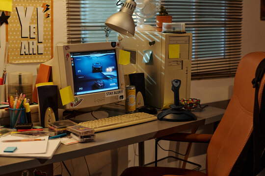 Well-organized workspace featuring vintage computer, various office supplies, and unique decorations creating a retro ambiance ideal for work or study