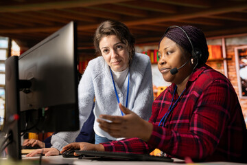 Call center supervisor providing support and guidance to intern, addressing questions. Customer...