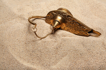 Lamp of Aladdin on sand