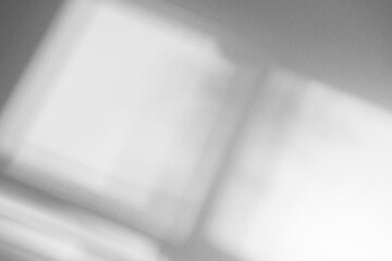 Abstract light reflection and grey shadow from window on white wall background, dark gray shadows and sunshine overlay effect for backdrop and mockup design