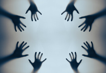 Silhouetted Hands Reaching Out Against Grainy Textured Background in Abstract Composition