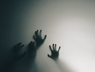 Silhouetted Hands Pressed Against Opaque Surface Evoking Mystery and Intrigue