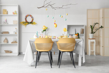 Interior of dining room with beautiful table setting for Easter celebration