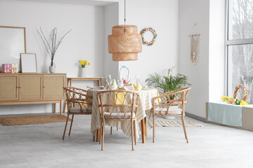 Interior of dining room with beautiful table setting for Easter celebration