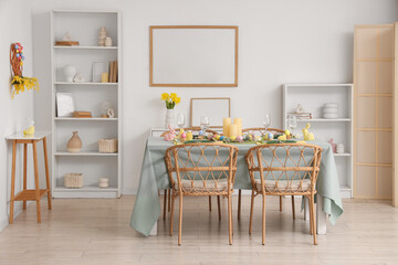 Interior of dining room with beautiful table setting for Easter celebration