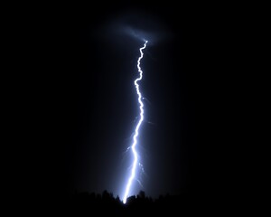 Naklejka premium A brilliant bolt of lightning strikes downward against darkness