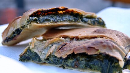 slices of erbazzone, also known as scarpazzone, is a typical Italian gastronomic specialty of Reggio Emilia, savory pie made with chard or spinach