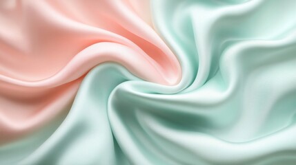 Fototapeta premium Swirling pastel pink and mint green silk fabric
