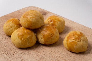 Close up of traditional nastar cookies on a wooden cutting board