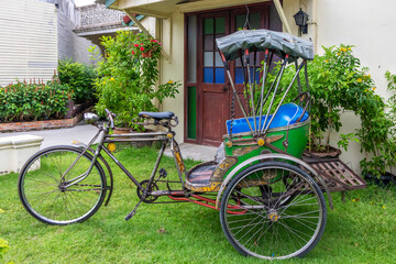 Rickshaw outside a house in Phuket Town, Thailand