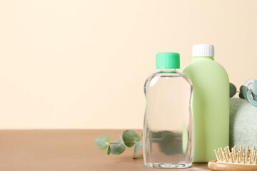 Baby oil and bath accessories on color background. Space for text