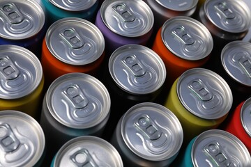Many aluminium cans of beverage as background, above view