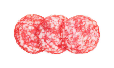Slices of tasty smoked sausage on white background, top view