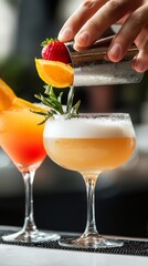 Bartender Preparing a Refreshing Cocktail with Orange and Strawberry Garnish
