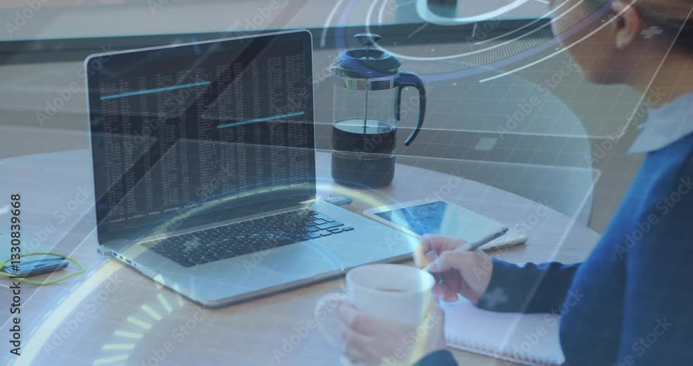 Poster person working on laptop with data processing animation over coffee and notebook