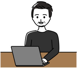 ノートパソコンを操作する髭を生やした中年男性