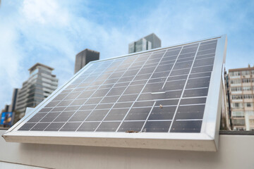 Fototapeta premium Solar panel installation on rooftop in an urban setting