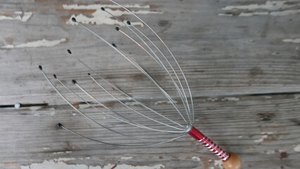 a style of iron that can be used to massage the head, and is popular in Asia