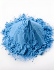 A vibrant pile of light blue powder sits on a white background. The texture is grainy and slightly lumpy, creating a visually interesting contrast against the clean backdrop.