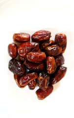 Dried dates on a white background.