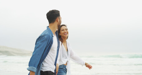Walking, happy couple and holding hands on beach for honeymoon, holiday or bonding outdoor. Woman,...