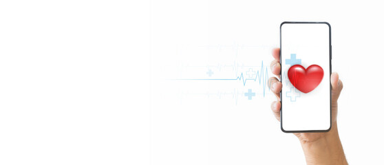 A hand holding a smartphone with a red heart and a medical heartbeat line  on the screen, symbolizing health and love. Digital health concept. Mobile health technology for healthcare applications.