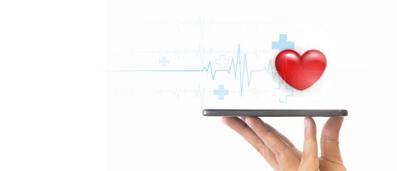 A hand holding a smartphone with a red heart and a medical heartbeat line  on the screen, symbolizing health and love. Digital health concept. Mobile health technology for healthcare applications.